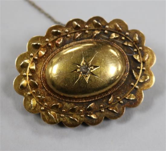 A Victorian yellow metal and diamond set oval brooch, 39mm.